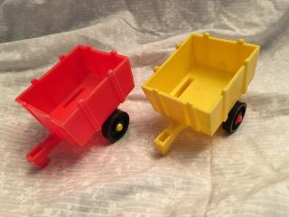 2 Fisher Price Little People Farm Wagons For The Barn.  One Yellow One Red.  3.  5