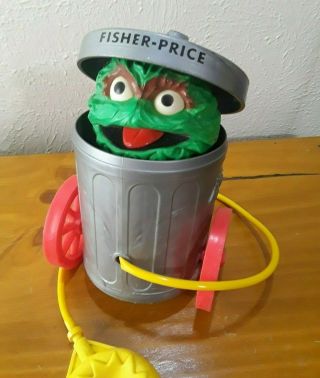 1977 Fisher Price 177 Sesame Street Oscar The Grouch Trash Can Pull Toy Squeeze