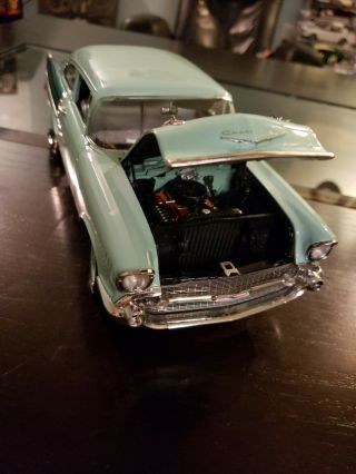1/18 SCALE DIECAST 1957 CHEVY 150 UTILITY SEDAN IN GREE BY HIGHWAY 61. 3