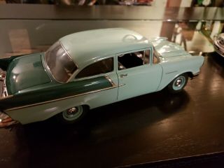 1/18 SCALE DIECAST 1957 CHEVY 150 UTILITY SEDAN IN GREE BY HIGHWAY 61. 4