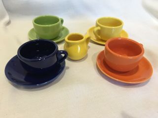 Four Multicolored Schylling Toy 2 " Tea Cups And 4 " Saucers & One 2 " Creamer