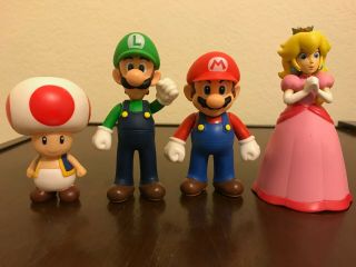 Mario,  Luigi,  Princess Peach,  And Toad Figurine Nintendo Characters
