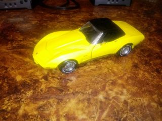 Franklin 1/24 1975 Corvette Yellow With No Box.  Displayed.