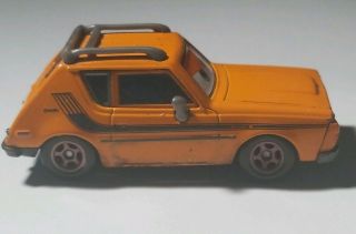Disney Pixar Cars 1/55 • J Curby Orange AMC Gremlin Lemons 4