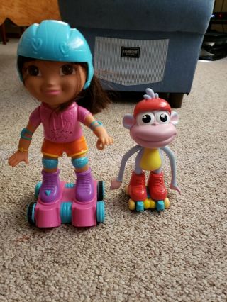 Fisher Price Skate & Spin Dora The Explorer & Boots Roller Skating Talking Doll