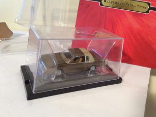 Buick Regal 1987 T - Type Brown.  In Case 1/64 Classic Gold 2006