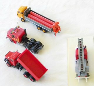 4 DIFFERENT 1/87 TRUCKS EACH HAS MINOR ISSUE (S) OR MISSING PART (S) 8
