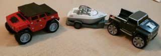 Two Little Tikes Hummers And Trailer With A Boat