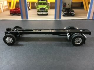 1/64 Speccast Rolling Single Axle Chassis W/ Flaps & Chrome Wheels