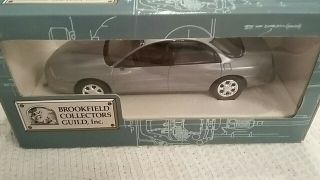 Brookfield Collectors Guild,  Inc 1996 Oldsmobile Aurora 1:25 Scale In Silver Tea