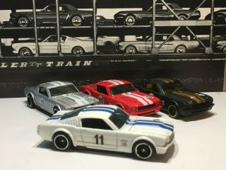 Hot Wheels 65 Mustang Fastback X4.  2008 Models Flat Black,  White,  Silver Red