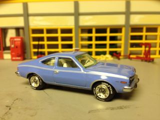 1/64 1974 Amc Hornet Hatchback Cpe.  In Pastel Blue/white Int/rubber Goodyears