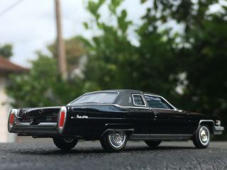 Auto World 1976 Cadillac Coupe Deville 1:64 Diecast Black With Vogue Tires