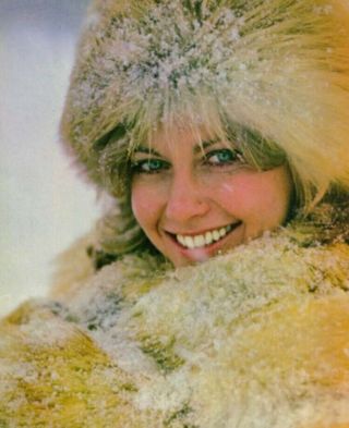 Olivia Newton John - A Cold Looking Headshot With A Smile
