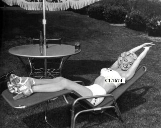 Marilyn Monroe Poses For A Portrait In A Bathing Suit And High Heels Photo