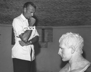 Gary Cooper Looking At A Bust Of Napoleon Photo
