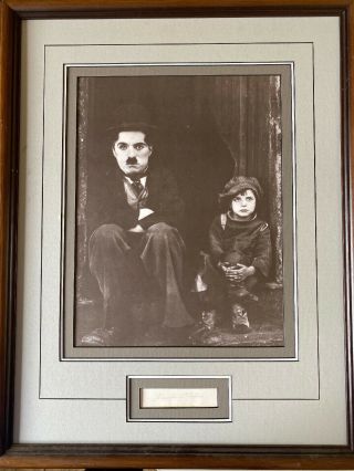Charlie Chaplin Signed Cutout (poor)