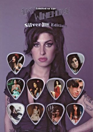 Amy Winehouse Guitar Picks On Photographic Background 10 Guitar Picks