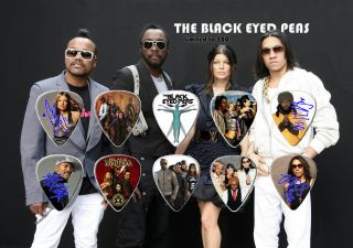 The Black Eyed Peas Guitar Picks On Photographic Background 10 Guitar Picks