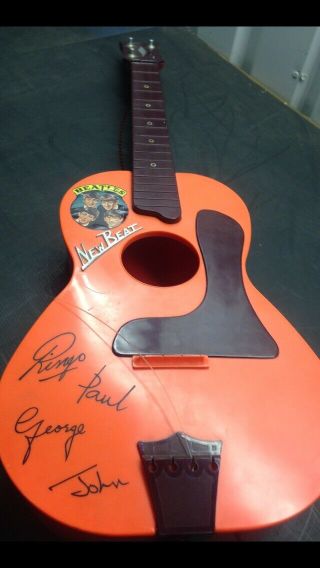 Beatles Beat Orange Toy Guitar - Early 1960s.  Spares