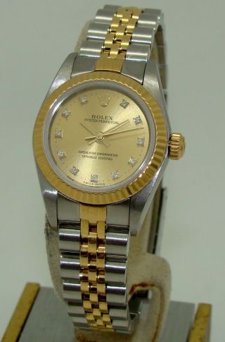 Rolex Womens Stainless & Gold Diamond Dial Oyster Perpetual Watch 67193 C.  2000