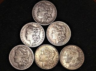 Six,  1881,  1882 S,  1884,  1880 O,  1921 D,  1921s Morgan Silver Dollars M