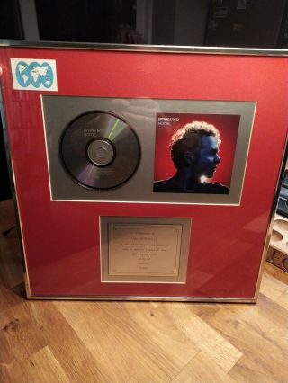 Simply Red Frame Award Presented To Ian Grenfell For " Home "