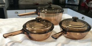 Corning Ware Visions Amber Cookware 6 Piece Set Sauce Pots Two.  5l & 1.  5l W/lids