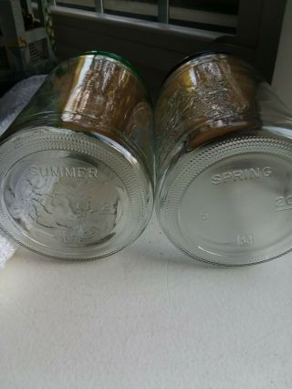 2 Anchor Hocking Tang jars with lids,  embossed Spring & Summer vintage 2