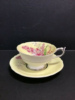 Paragon China Tea Cup And Saucer Yellow Ground Pink Lilac Bouquet Double Warrant