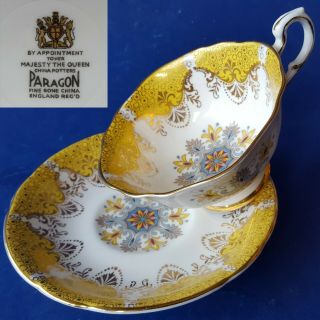 Paragon Fine Bone China England Teacup & Saucer.  Yellow Gold Filigree Flowers