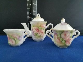 Porcelain Floral Mini Teaset: Teapot,  sugar bowl,  creamer,  cups and saucers 2