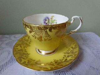 Paragon Bone China Yellow/heavy Gold Gild Center Floral Footed Cup & Saucer