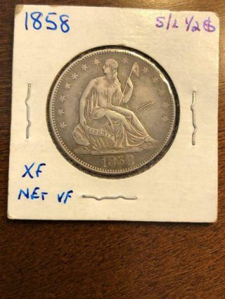 1858 Seated Liberty Half Dollar (circulated).  900 Silver Xf (cud Obverse?)