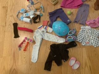 American Girl Dolls And A Bunch Of Clothing And Accessories