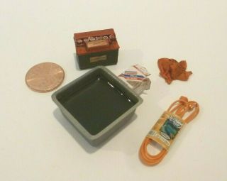 Miniature Auto Items,  Pan Of Oil Filter,  Battery,  Rag & Extension Cord
