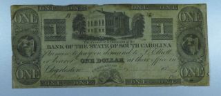 1860 $1 Note.  Bank Of The State Of South Carolina.  Charleston.  Cu087/arh