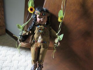 Native American Porcelin Indian Doll & On A Swing