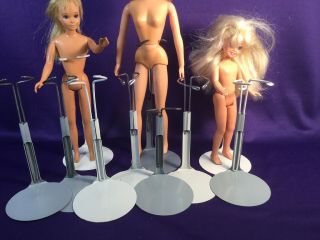 Kaiser Doll Stands.  (10) Hold Various Sized Dolls.  Gray & White Bases.