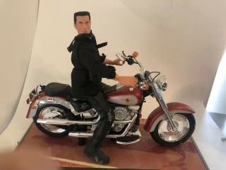 Arnold Schwarzenegger Action Figure And Harley Davidson Fat Boy Motorcycle.