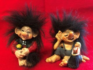 Vintage Candy Design Of Norway Troll Figurines Sitting With Tails