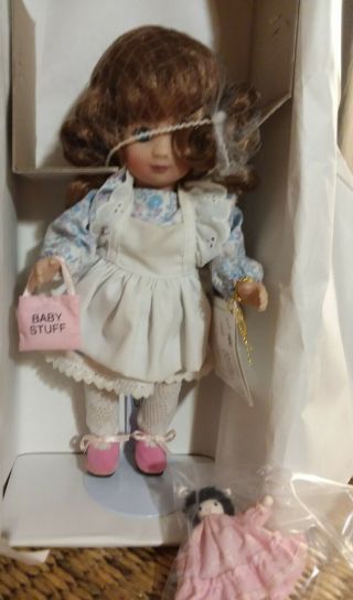 Marie Osmond Doll.  Mib.  C13714.  " Playing Mommy ".  11 " Tall With Stand.  Mo9