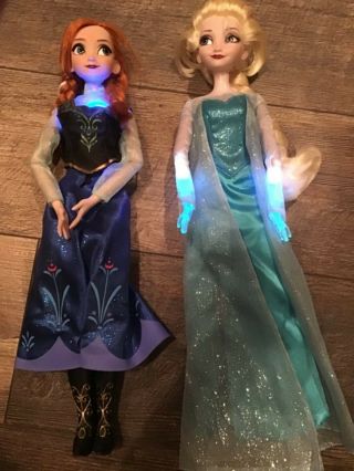 Disney Store 16” Singing Elsa And Anna Dolls.
