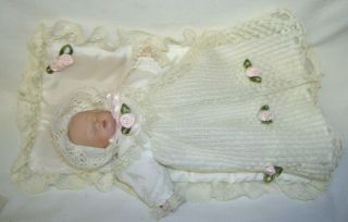 Adorable Baby Doll In Lace Gown And Bonnet With Pink Floral Accents