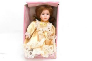 Small Vintage Porcelain Doll Collectors Yellow Dress & Brunette Hair