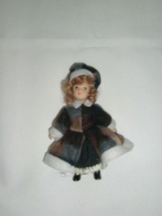 Bisque Porcelain Jointed Mini Doll Dressed In Winter Outfit With Matching Hat